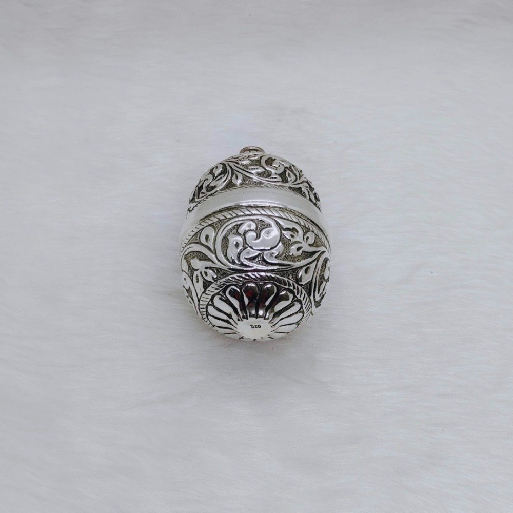 Pure silver nariyal in antique carvings for pujan and tilak